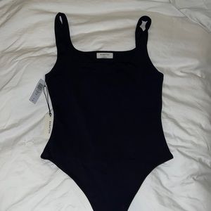 Never worn aritzia contour tank bodysuit in black, size large.